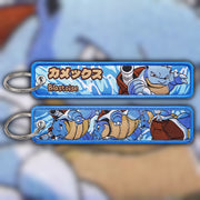 Blastoise blue and cream woven fabric keytag attached to metal keyring featuring embroidered Blastoise artwork
