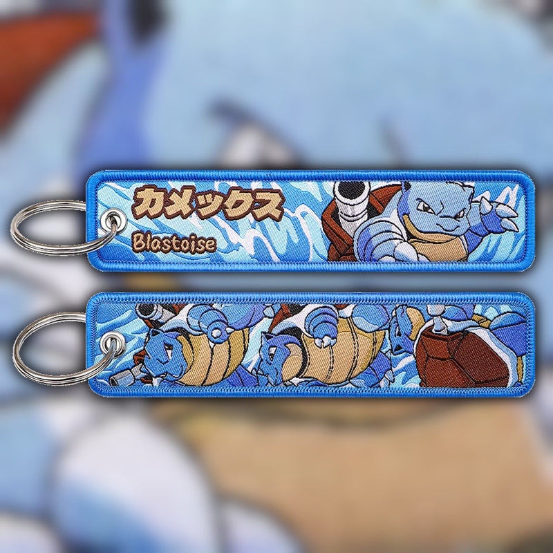 Blastoise blue and cream woven fabric keytag attached to metal keyring featuring embroidered Blastoise artwork