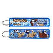Back side view of Blastoise embroidered keytag showing detailed stitching and fabric border