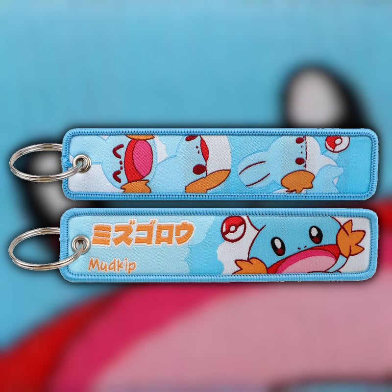 Mudkip blue woven fabric keytag attached to metal keyring featuring embroidered Mudkip artwork