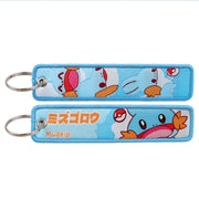 Back side view of Mudkip embroidered keytag showing detailed stitching and fabric border
