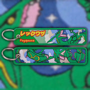 Rayquaza emerald green woven fabric keytag attached to metal keyring featuring embroidered Rayquaza artwork