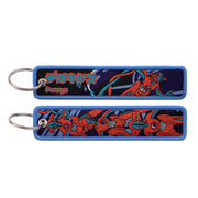 Back side view of Deoxys embroidered keytag showing detailed stitching and fabric border