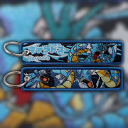 Gyarados blue woven fabric keytag attached to metal keyring featuring embroidered Gyarados artwork