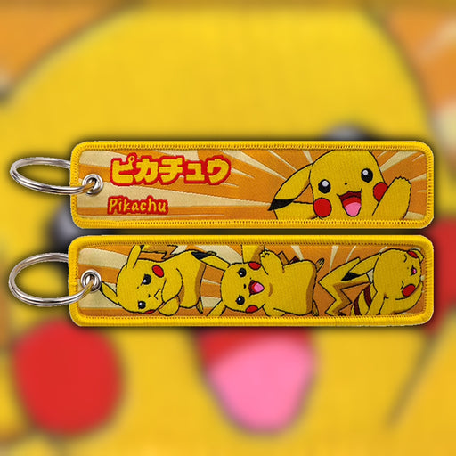 Pikachu yellow woven fabric keytag attached to metal keyring featuring embroidered Pikachu artwork