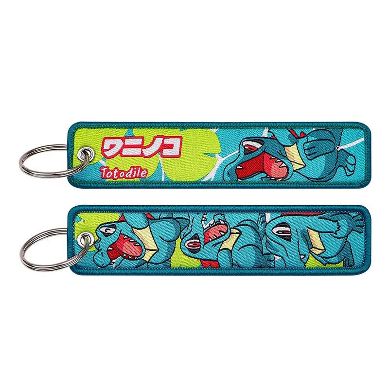 Back side view of Totodile embroidered keytag showing detailed stitching and fabric border