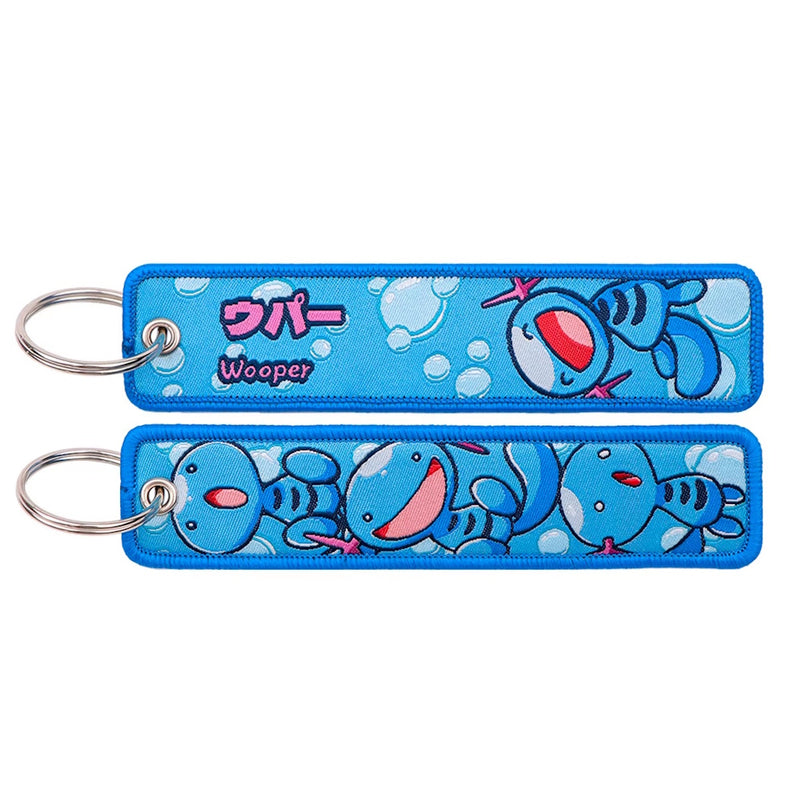 Back side view of Wooper embroidered keytag showing detailed stitching and fabric border